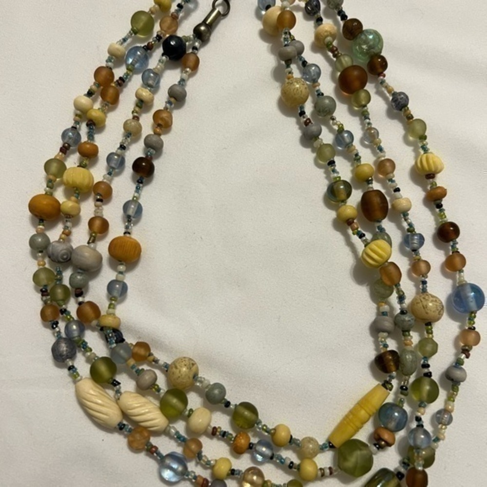 Gorgeous two-strand multi-colored necklace, 35” long. Soft colors. EUC.